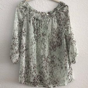 Quintessential sheer animal print blouse!